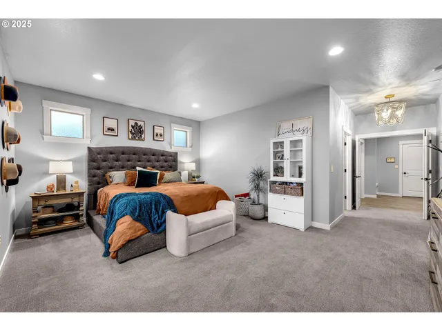 a bedroom with a bed and a view of kitchen