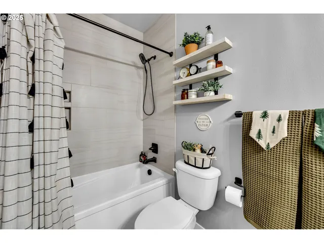 a bathroom with a bathtub sink and toilet