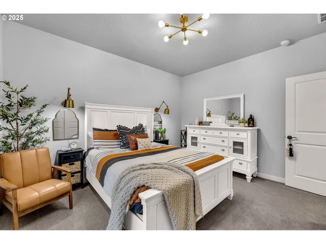 a bedroom with a bed and a couch