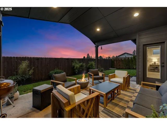 a patio with tables and chairs