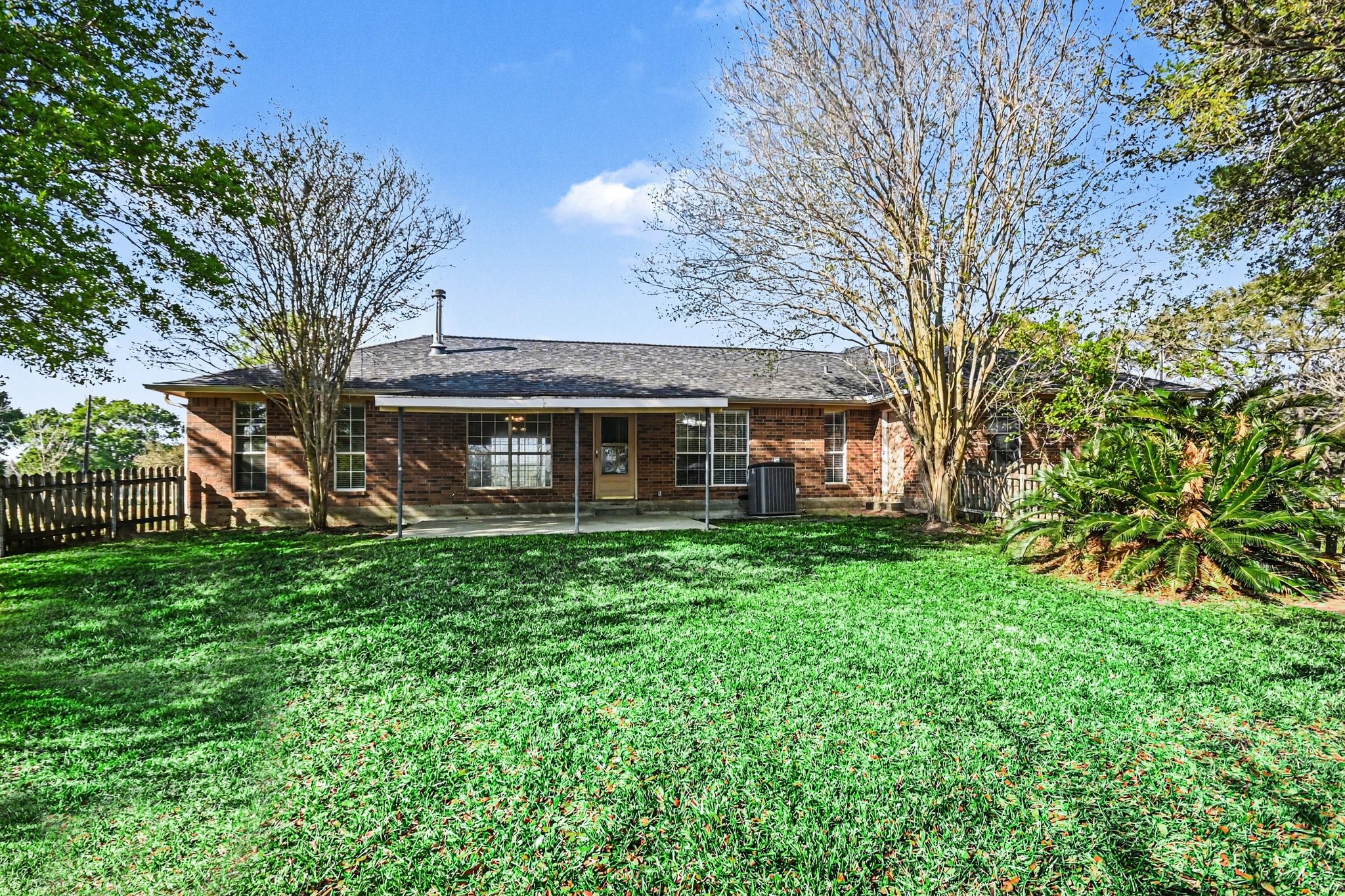 21503 Pecan Bend Road Damon, TX 77430 - Photo 30 of 45 a view of a house with a yard