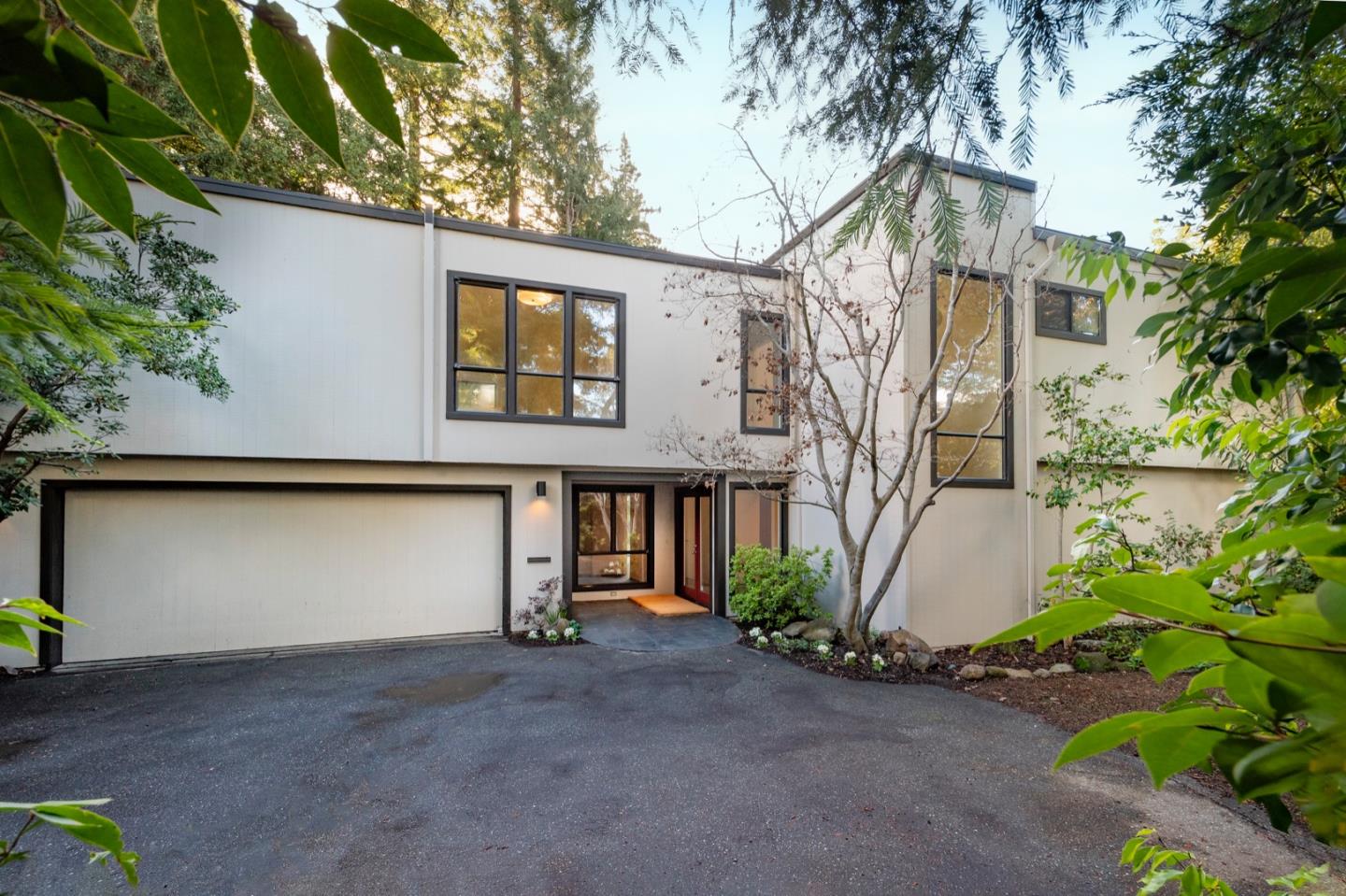 a front view of a house with garden