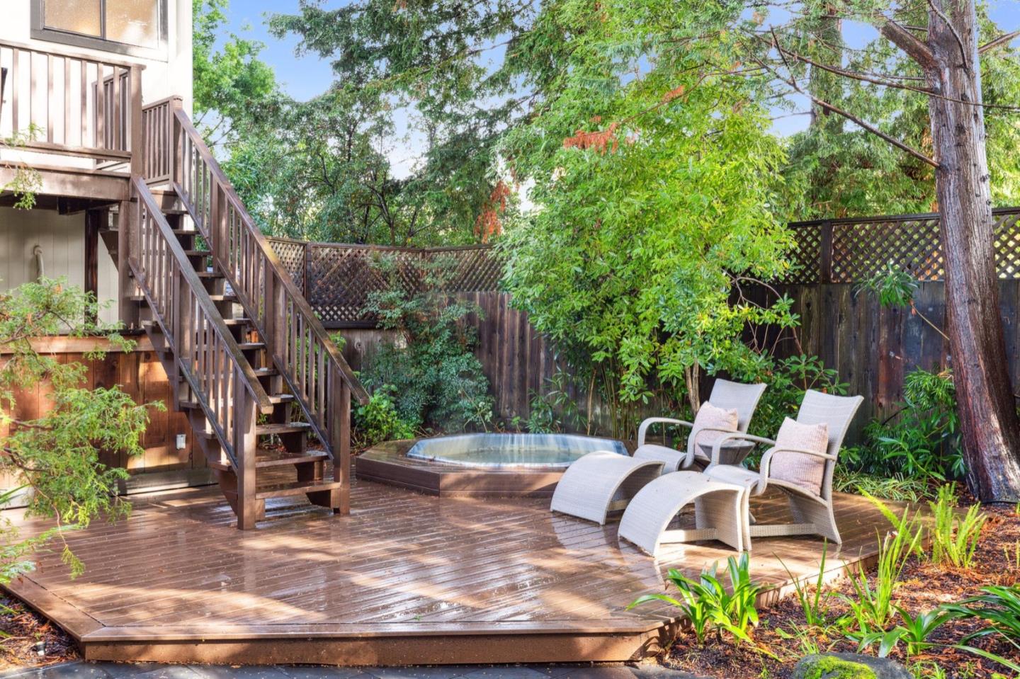 1732 Middlefield Road Palo Alto, CA 94301 - Photo 24 of 42 a view of a patio with table and chairs potted plants and large tree