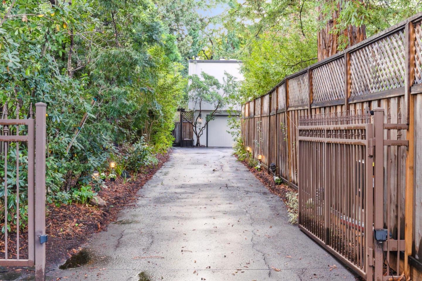 1732 Middlefield Road Palo Alto, CA 94301 - Photo 3 of 42 a view of a pathway of a house with wooden fence