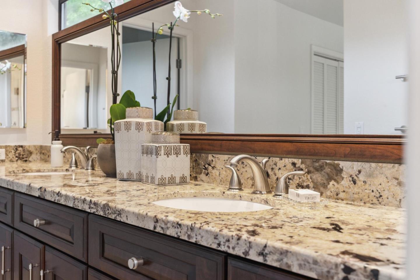 1732 Middlefield Road Palo Alto, CA 94301 - Photo 32 of 42 a bathroom with a granite countertop sink and a mirror