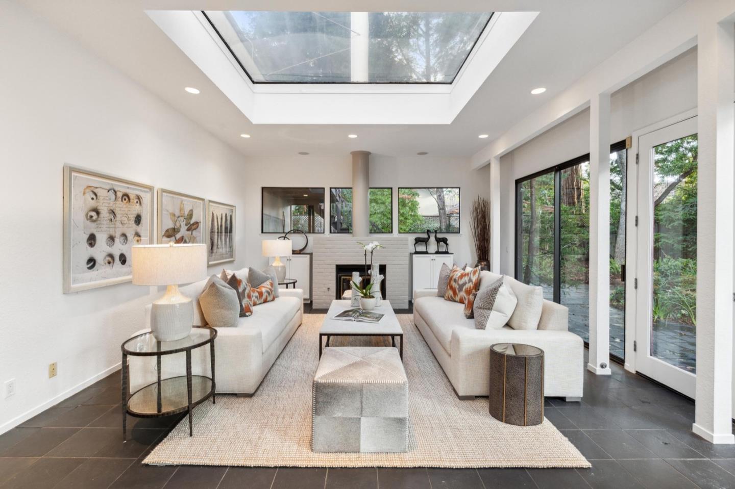 1732 Middlefield Road Palo Alto, CA 94301 - Photo 8 of 42 a living room with furniture large windows and wooden floor