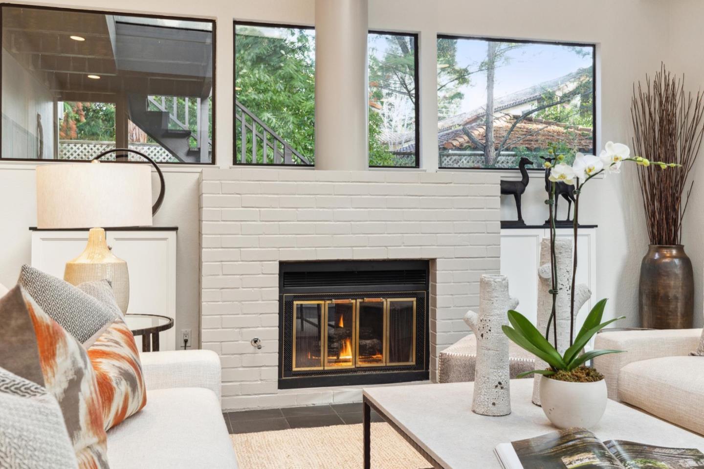 1732 Middlefield Road Palo Alto, CA 94301 - Photo 9 of 42 a living room with furniture a large window and a fireplace
