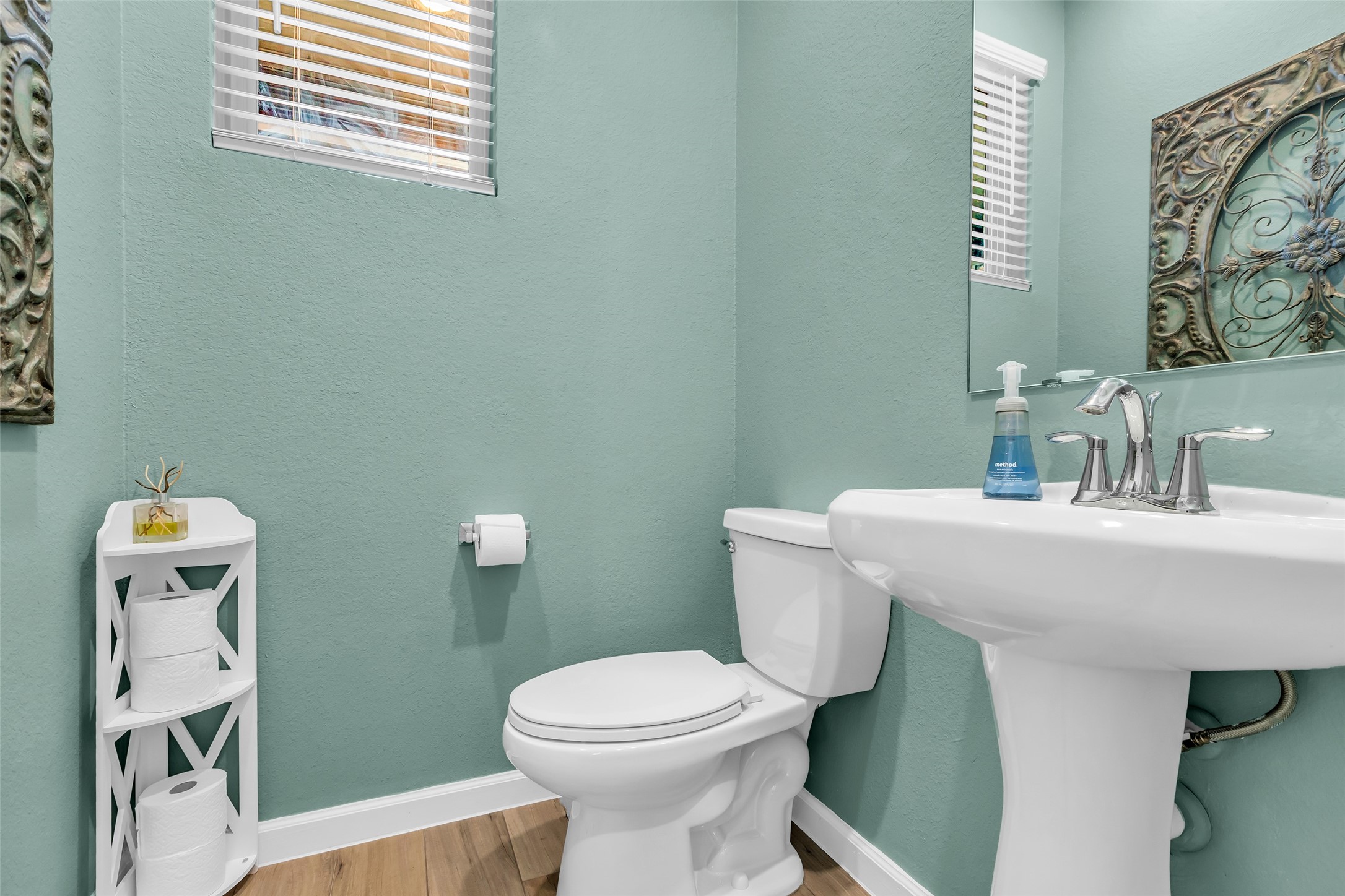 9502 Marble Park Lane Baytown, TX 77521 - Photo 12 of 40 a bathroom with a toilet a sink and a mirror