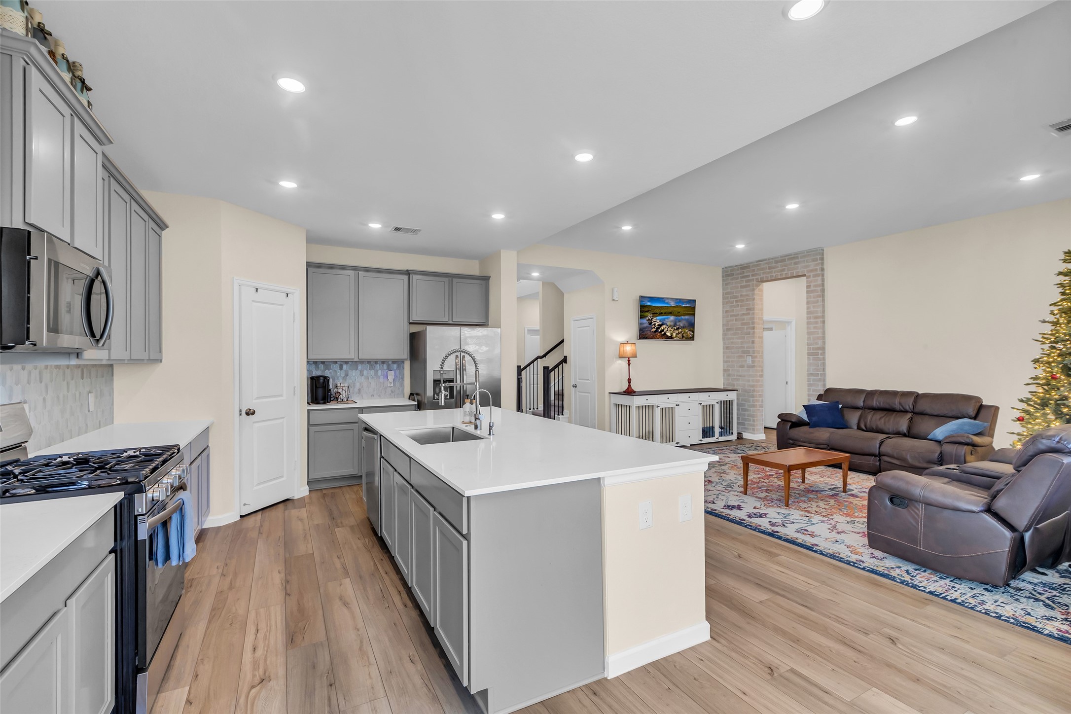 9502 Marble Park Lane Baytown, TX 77521 - Photo 18 of 40 a large white kitchen with stainless steel appliances