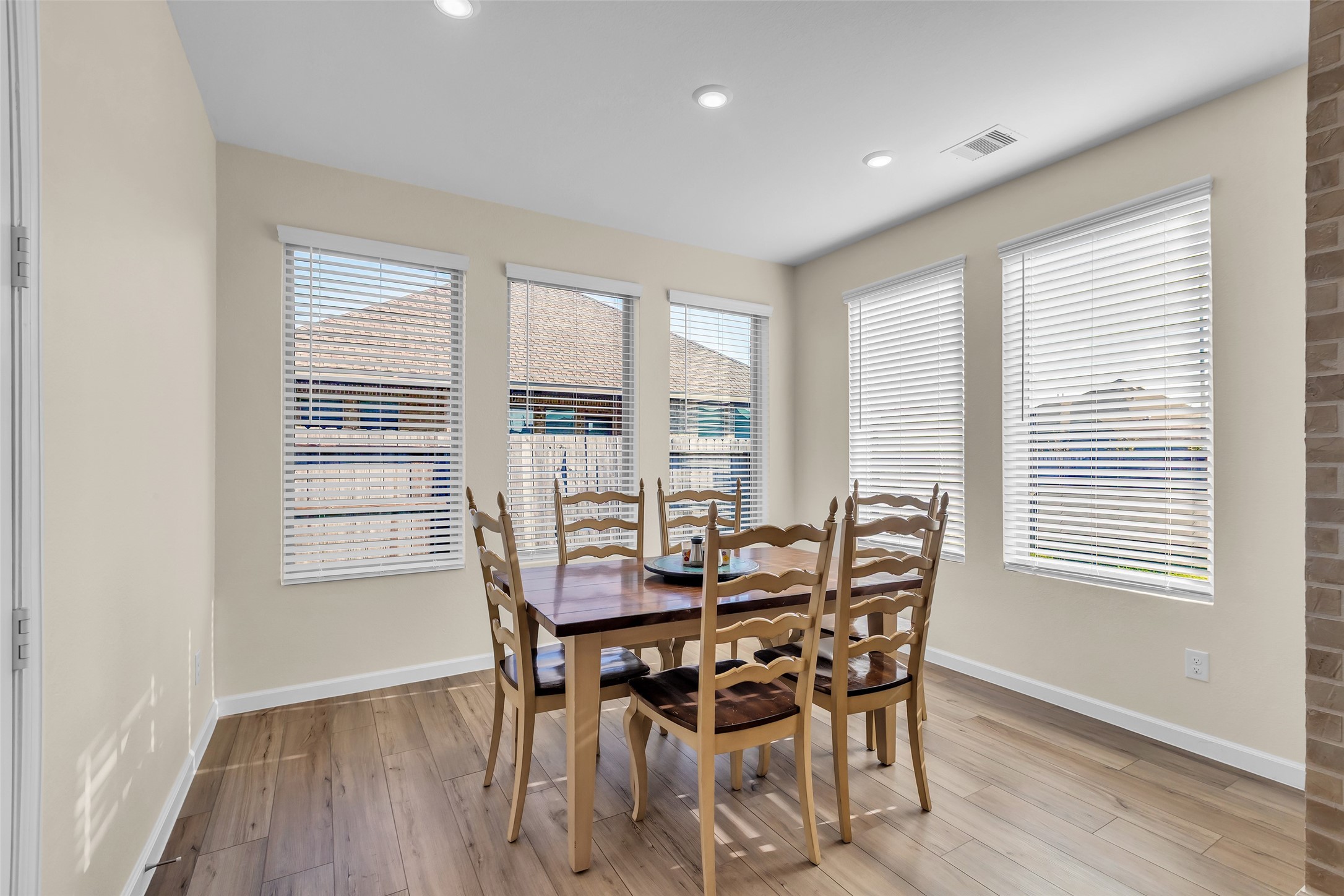 9502 Marble Park Lane Baytown, TX 77521 - Photo 24 of 40 a dining room with furniture and wooden floor