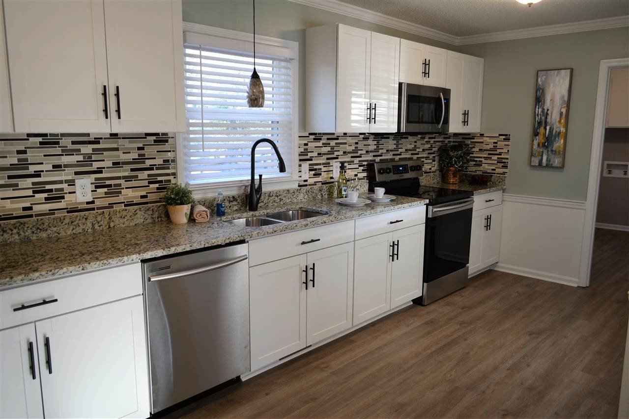 7249 Rock Service Station Road Raleigh, NC 27603 - Photo 6 of 25 Open & spacious-perfect for the cook & entertaining! Designer kitchen