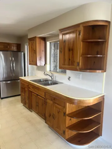a kitchen with a sink and cabinets