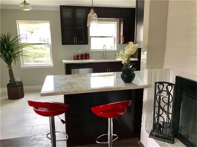 a kitchen with a dining table and chairs