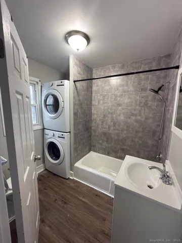 a bathroom with a sink a mirror and shower