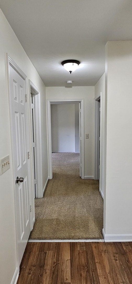 833 Village Quarter Road, Unit A3 West Dundee, IL 60118 - Photo 21 of 27 wooden floor in a hall with an entryway