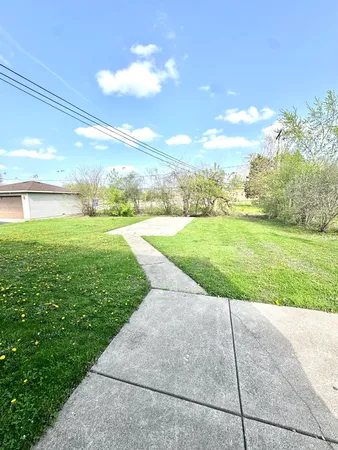 a view of a yard with an ocean and a big yard
