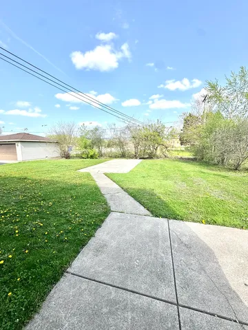a view of a yard with an ocean and a big yard
