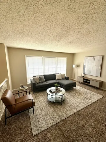 a living room with furniture and a couch