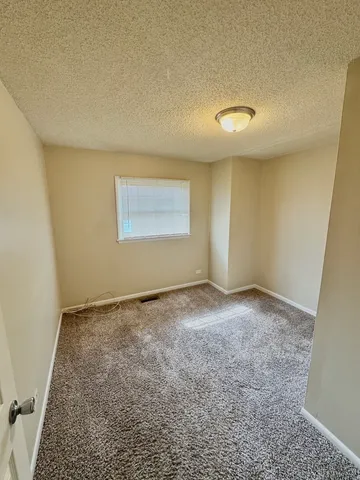 an empty room with a natural light