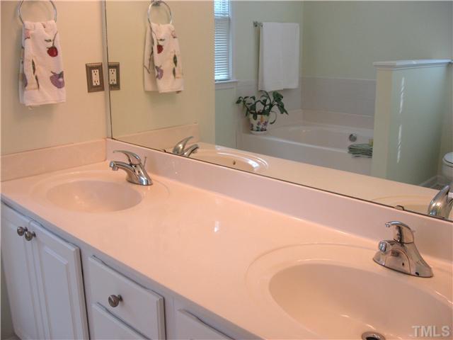 1515 Patterson Grove Road Apex, NC 27502 - Photo 12 of 25 Master bath has dual vanities and nickel fixtures and hardware.