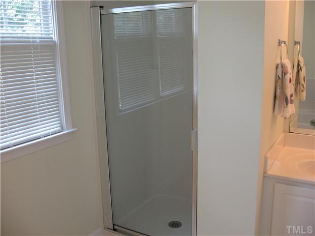 1515 Patterson Grove Road Apex, NC 27502 - Photo 14 of 25 Separate shower in the master bath. Tankless hot water heater just installed last year.