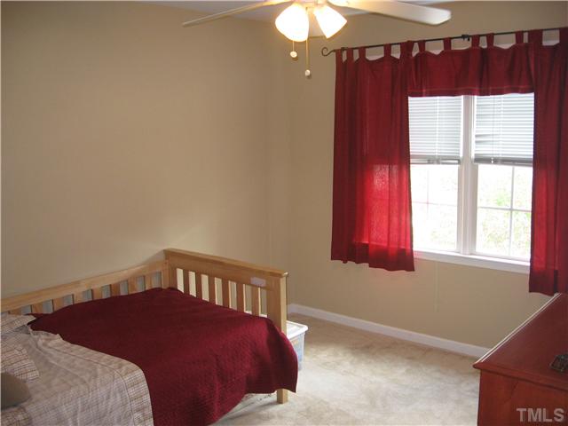 1515 Patterson Grove Road Apex, NC 27502 - Photo 15 of 25 Nice size bedroom has new carpet and ceiling fan.