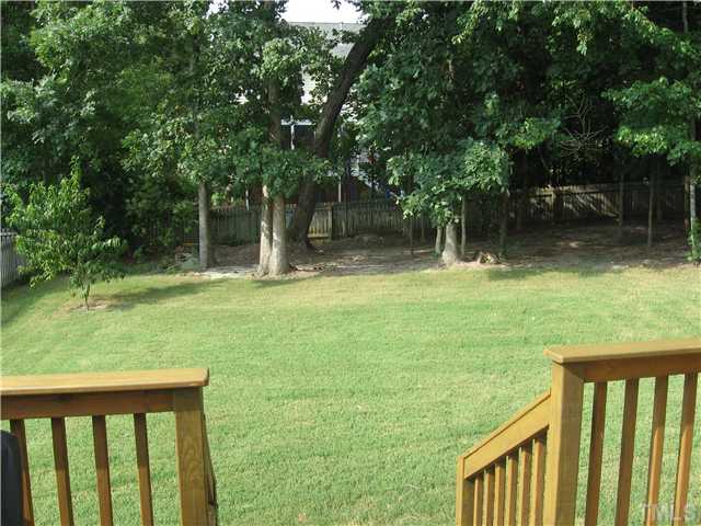 1515 Patterson Grove Road Apex, NC 27502 - Photo 21 of 25 A view off the deck. Back yard is completely fenced and has a wooded natural area in the back for privacy.