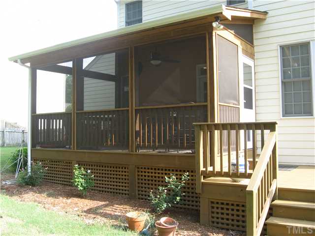 1515 Patterson Grove Road Apex, NC 27502 - Photo 22 of 25 The lattice around the deck and porch gives it a nice finished look.