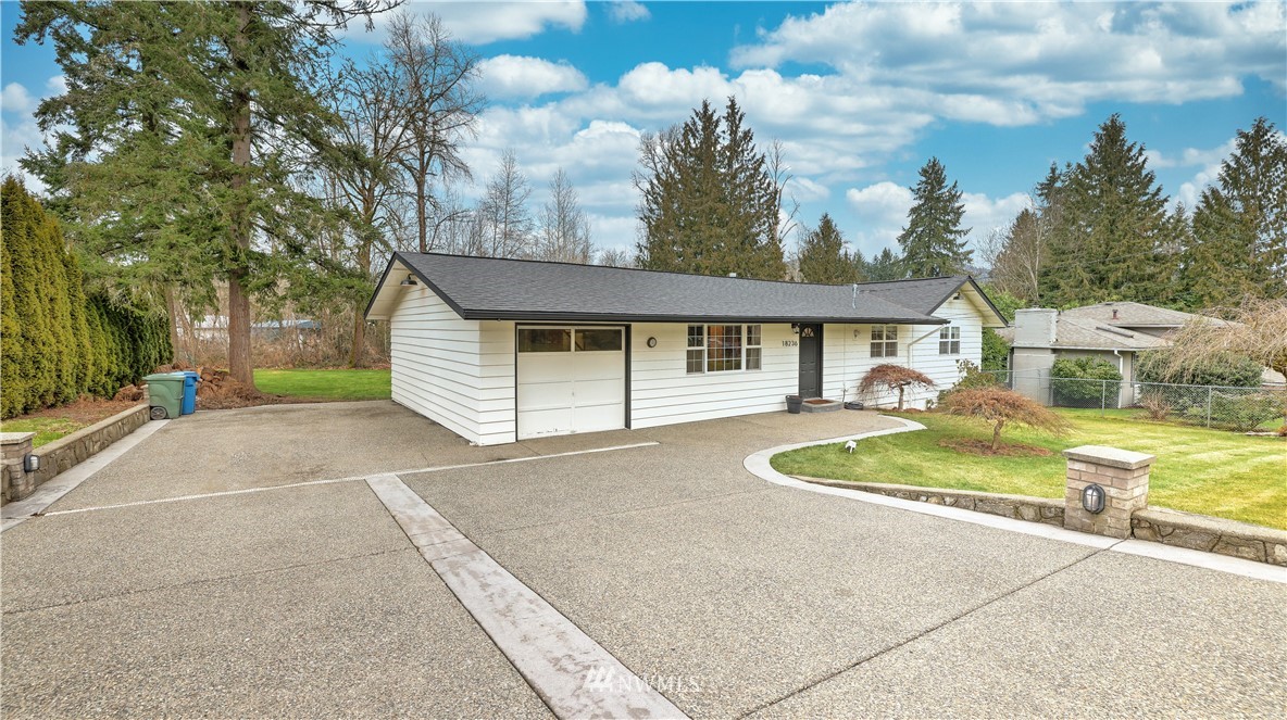 18236 Southeast 135th Street Renton, WA 98059 - Photo 28 of 31 a front view of a house with a yard
