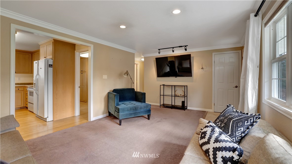 18236 Southeast 135th Street Renton, WA 98059 - Photo 7 of 31 a living room with furniture and a flat screen tv