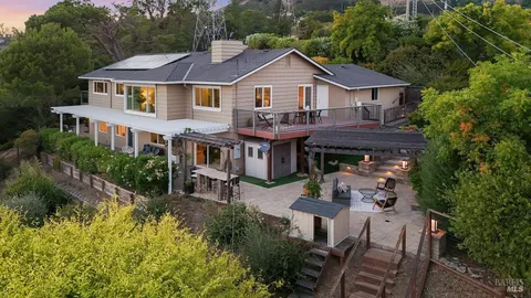 a view of a patio with a table chairs and a table