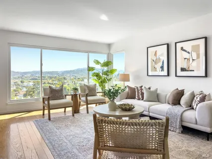 a view of a dining room with furniture and window