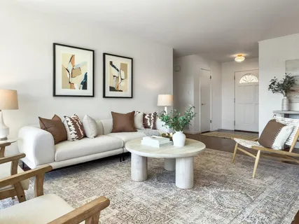 a view of a dining room with furniture and chandelier