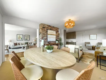 a kitchen with granite countertop a sink a stove and cabinets