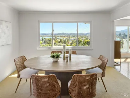 a kitchen with stainless steel appliances white cabinets and a refrigerator
