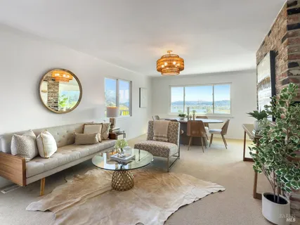 a view of a roof deck with table and chairs floor to ceiling window with wooden floor