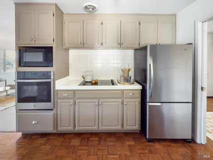 a view of a chairs and table on the wooden floor