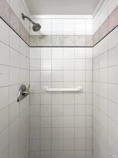 a dining room with furniture a chandelier and wooden floor