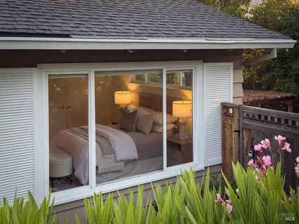 a living room with furniture and a lamp