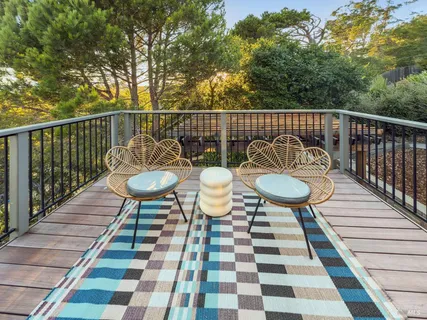 a view of a patio with table and chairs and potted plants