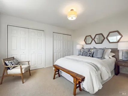 an aerial view of a house with a garden and lake view