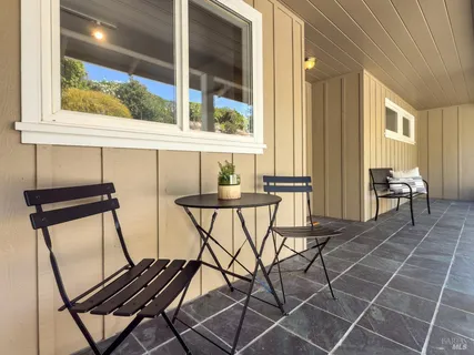 a view of a chairs and table in the outdoor view