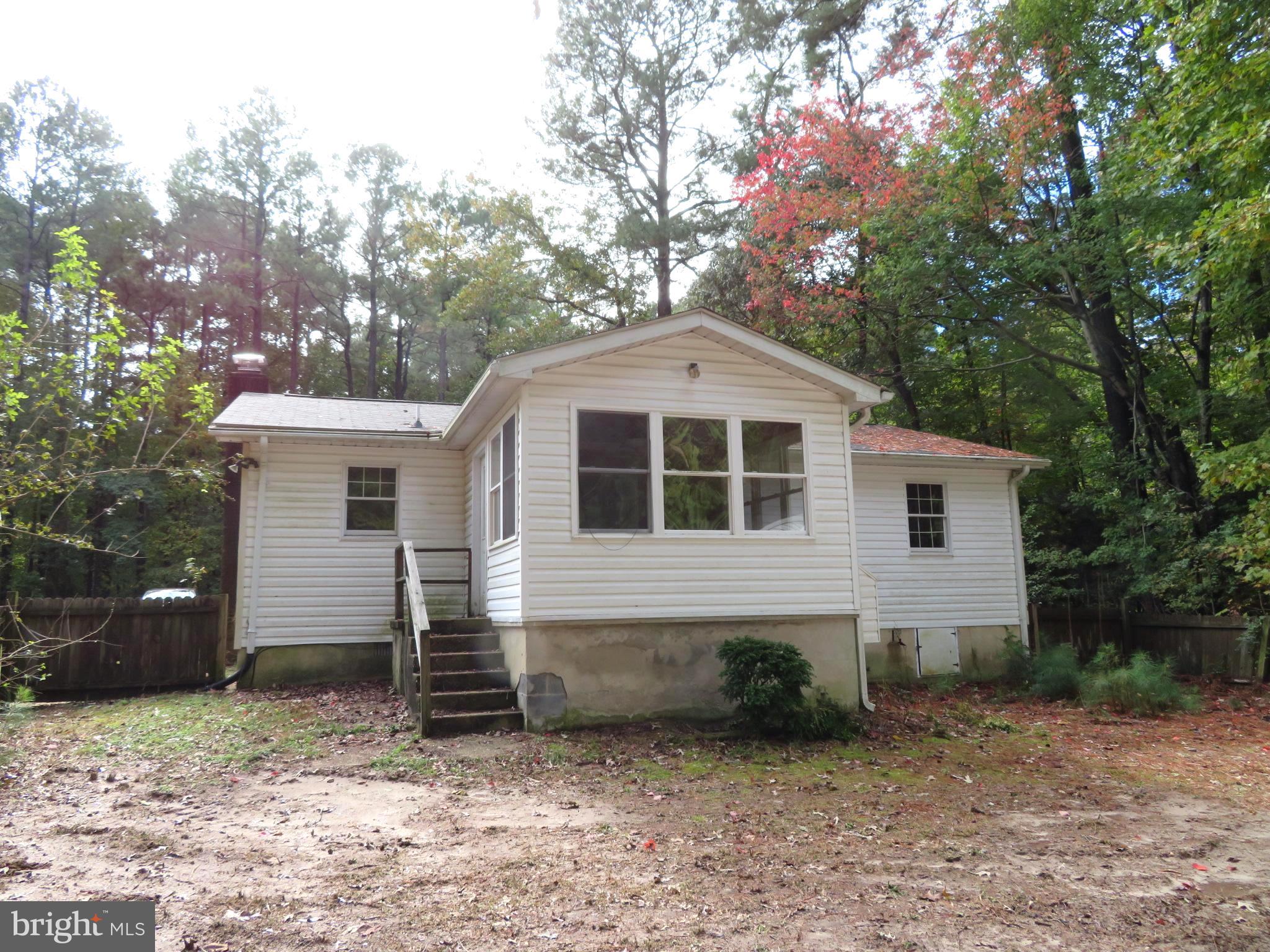 330 Pilot Way Lusby, MD 20657 - Photo 2 of 19 a front view of a house with a yard