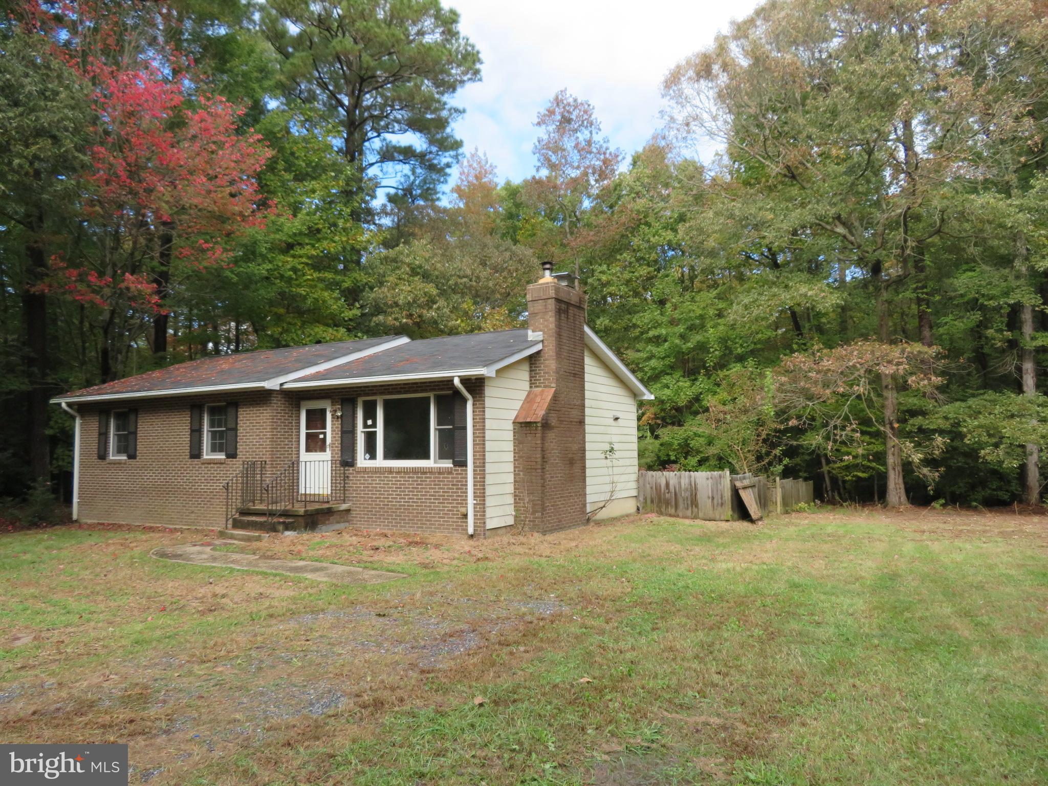330 Pilot Way Lusby, MD 20657 - Photo 12 of 19 a front view of a house with yard and green space