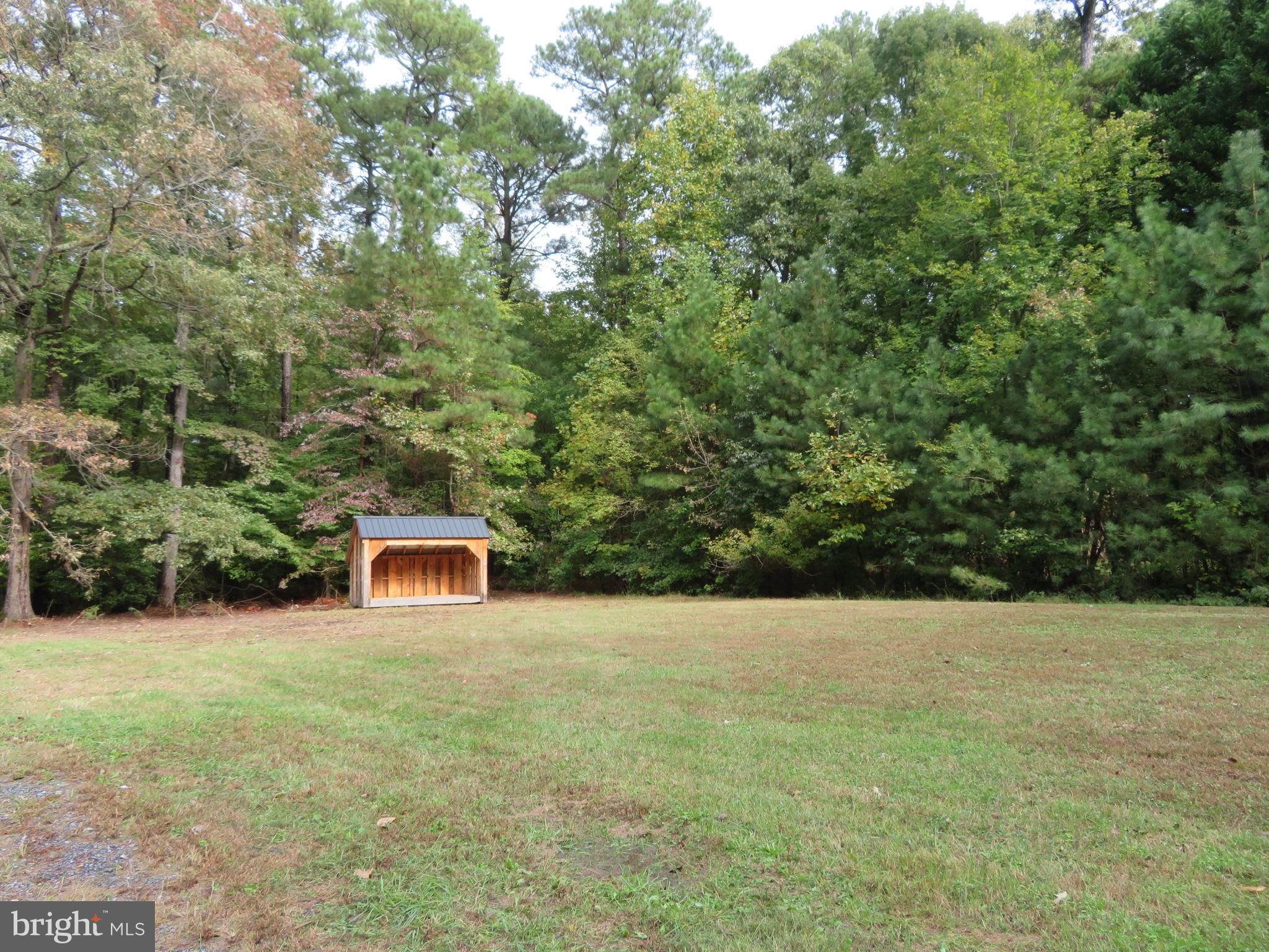 330 Pilot Way Lusby, MD 20657 - Photo 17 of 19 a view of a house with yard and large trees
