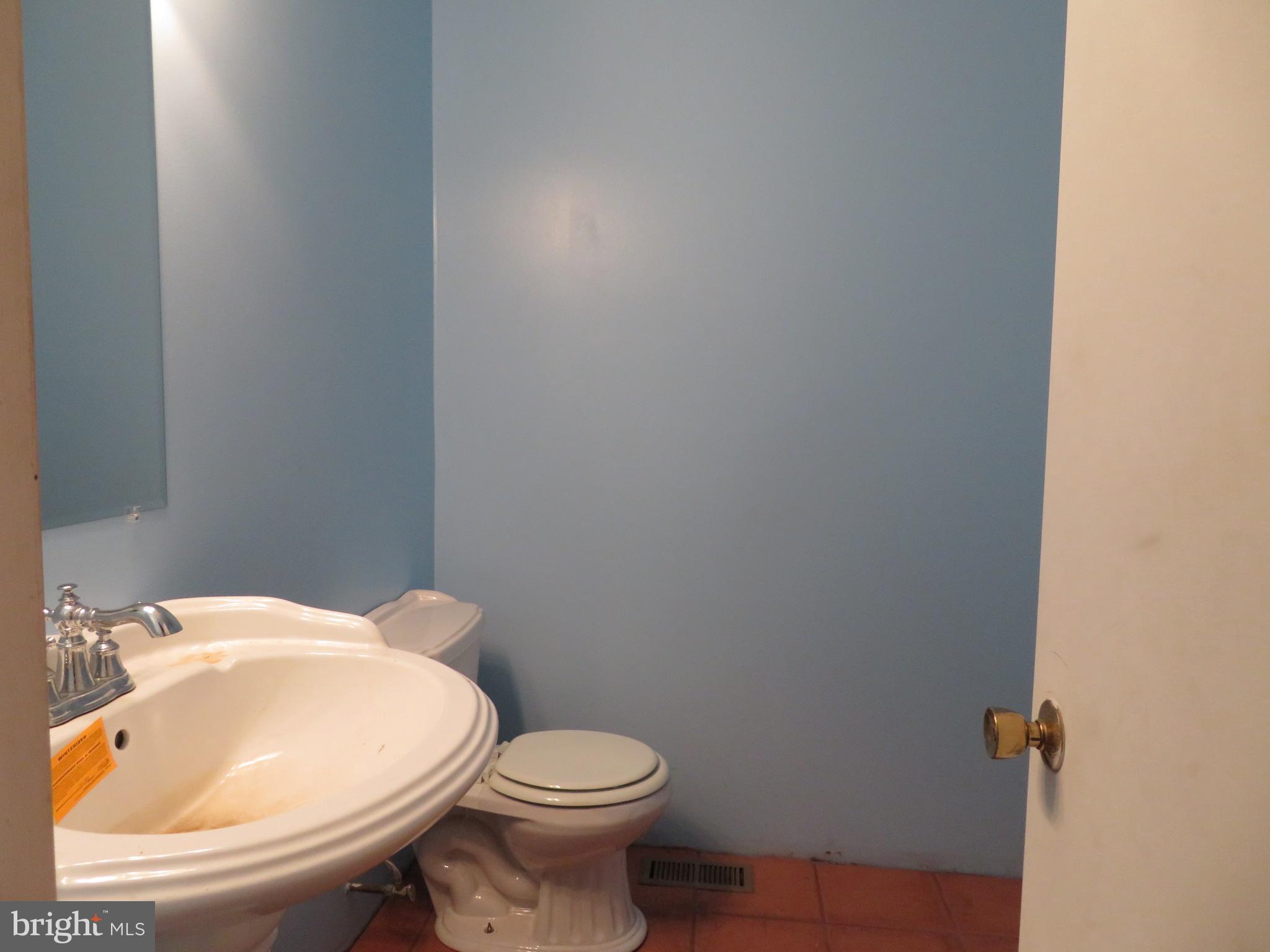 330 Pilot Way Lusby, MD 20657 - Photo 7 of 19 a white toilet sitting next to a bathroom sink