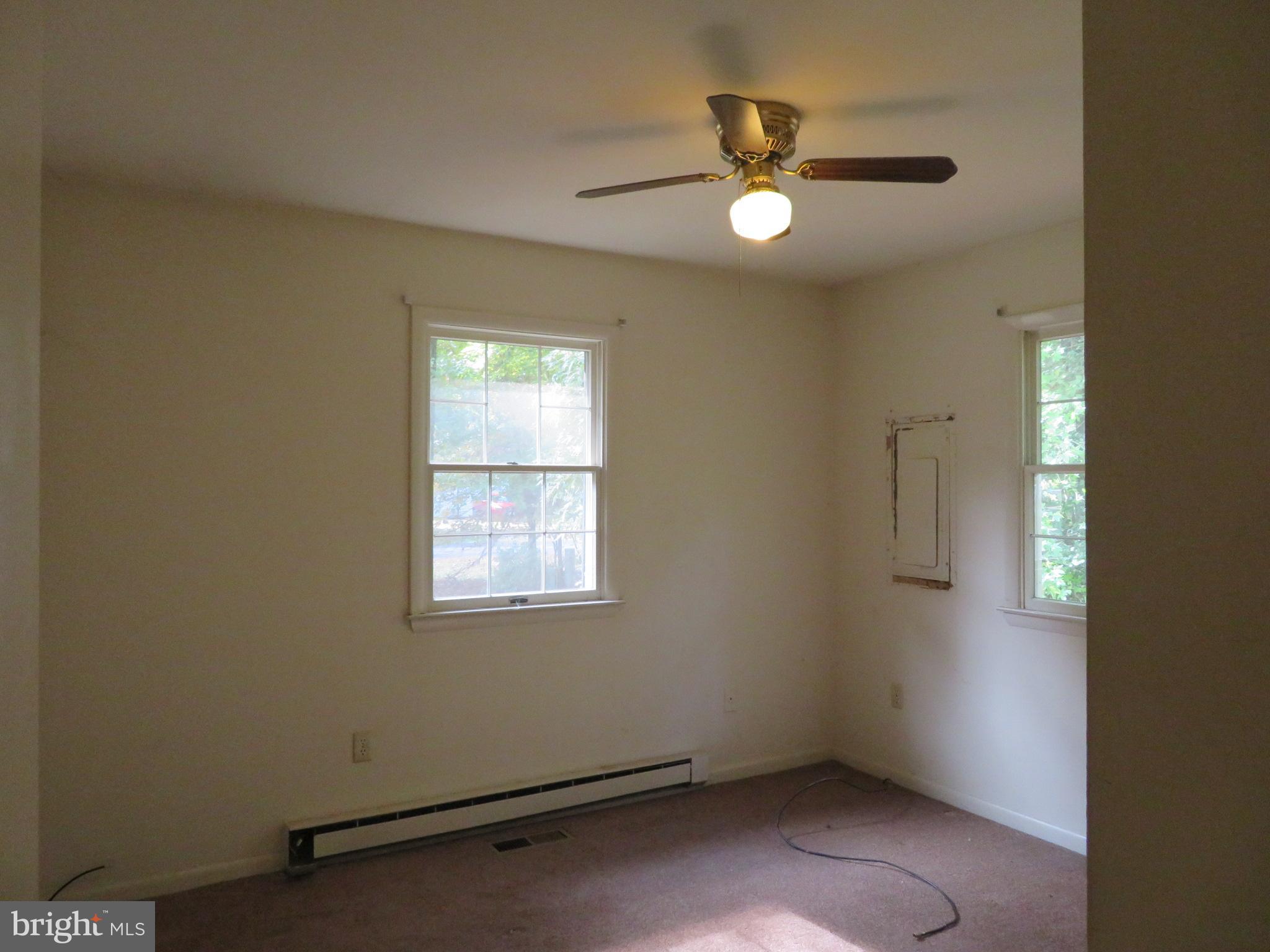 330 Pilot Way Lusby, MD 20657 - Photo 8 of 19 an empty room with closet and windows
