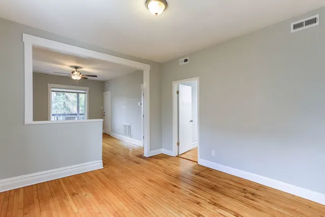 a kitchen with stainless steel appliances a sink a stove a refrigerator and cabinets