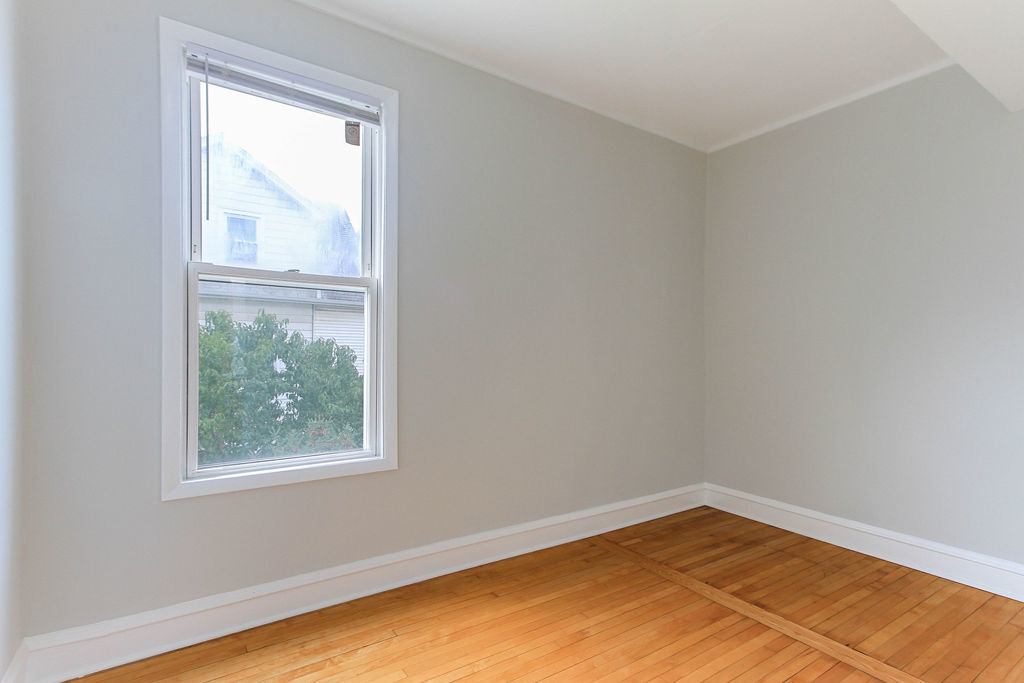 6046 West Giddings Street Chicago, IL 60630 - Photo 25 of 46 an empty room with a window