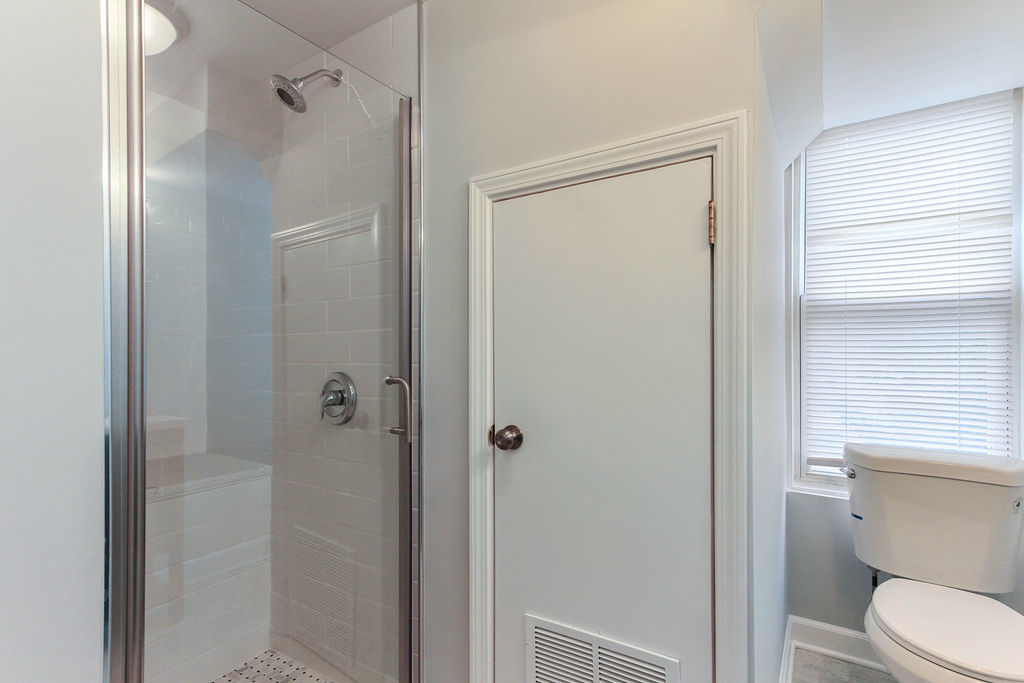 6046 West Giddings Street Chicago, IL 60630 - Photo 27 of 46 a bathroom with a toilet and a shower